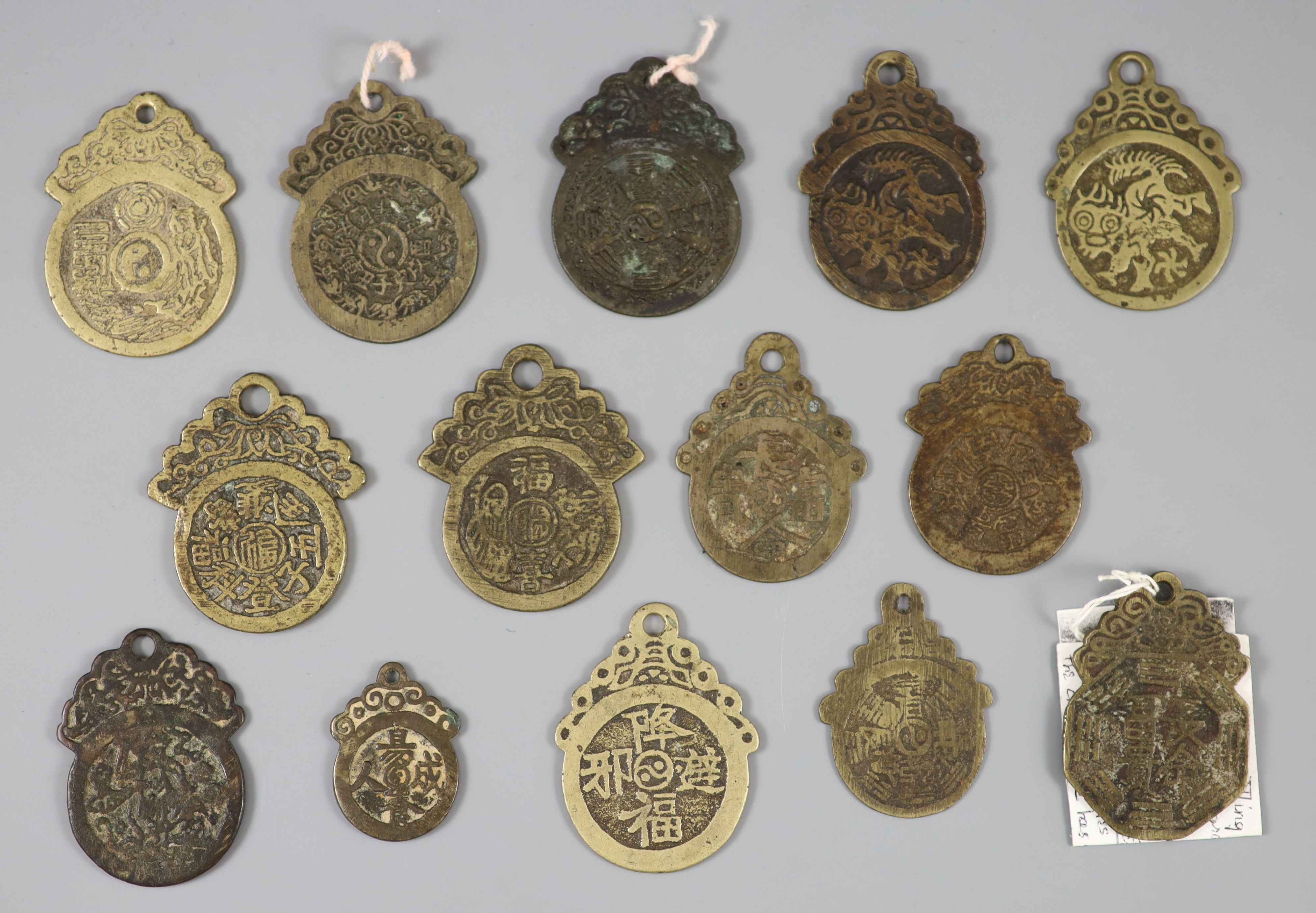 China, 14 bronze pendant charms or amulets, Qing dynasty,